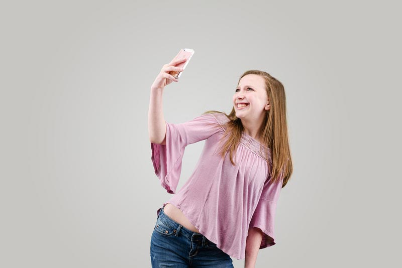 young woman taking selfie