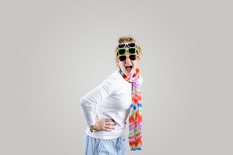 girl with 3 pairs of sunglasses on head
